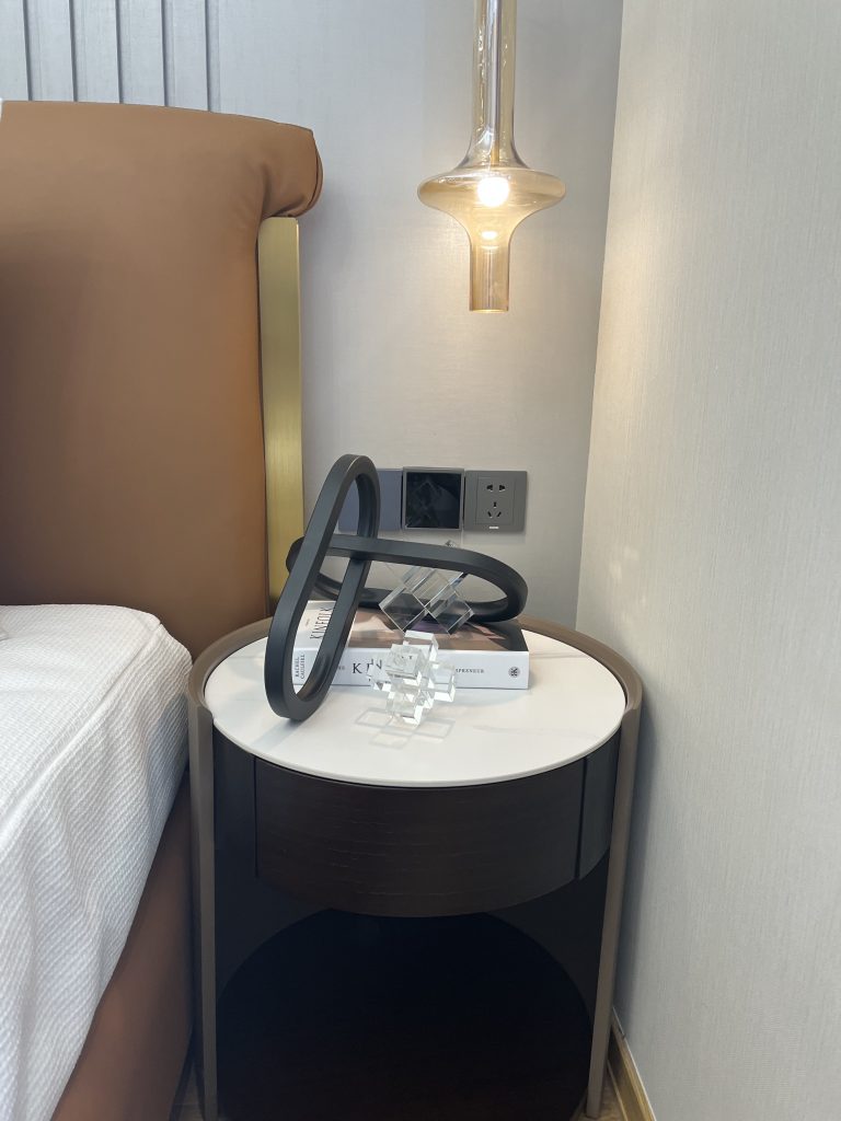 Modern black metal and clear crystal decorative accent on a bedside table