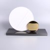 geometric marble and metal sculpture
