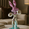 Chrome boxing bunny sculpture pink and cyan in modern living room